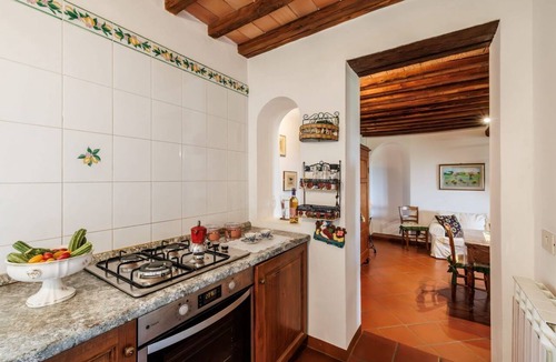 Castelnuovo Berardenga Apartment | A spacious 120 sqm apartment, ideal for six guests, situated within a charming estate in the Chianti hills in a peaceful setting along a traffic-free road. Guests have access to a private garden with a furnished patio - perfect for enjoying the outdoors