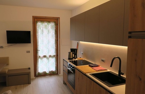Pur Apartment | Erdgeschosswohnung mit möbliertem Garten by Interhome