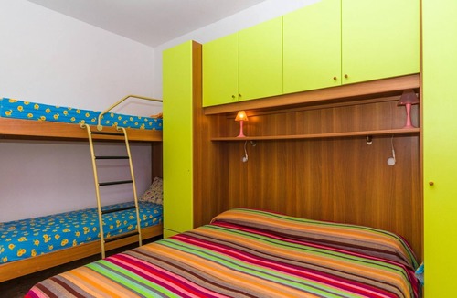 Bibione Pineda Apartment | Gabbiano tree-room flat surrounded by the green of the quite pine forest
