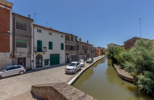 Comacchio Apartment | GuestHost - Comfortable apartment located on the second floor of a building NOT equipped with a lift.In 63 m2 of space it comfortably accommodates 5 people with a double sofa bed in the living room, a double bedroom and a bedroom with a single bed.Locate