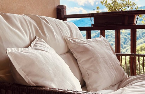 Sanfront House | Panoramic two-story dwelling with private garden, surrounded by green woods.