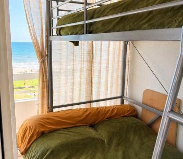 La Cote Radieuse Apartment | Studio cabine pied dans l eau climatisé, parking et wifi haut débit