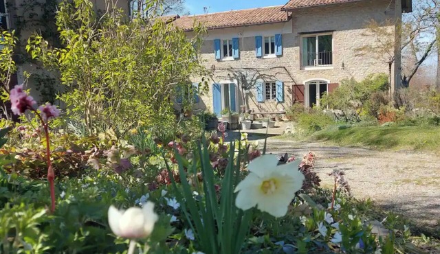 A charming stone house set in a hillside garden in Emilia-Romagna