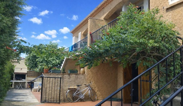 Apartment with balcony upstairs of a villa 300 m from the sea