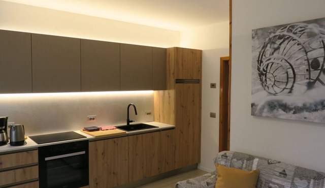 Erdgeschosswohnung mit möbliertem Garten by Interhome