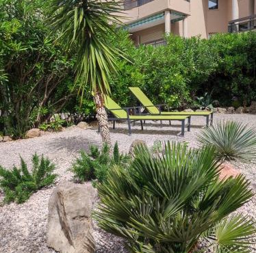 Le Palmier, jardin privatif, plage 200m, centre et restaurants à deux pas, climatisé, wifi, garage, rénové