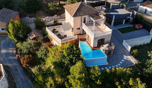 Villa with a pool, hot tub, and panoramic view